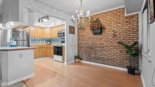 6108 Sanlin Dr, Moon/Crescent Twp, PA 15108 - kitchen featuring stainless steel appliances, brick wall, light wood-style flooring, a chandelier, and light brown cabinets