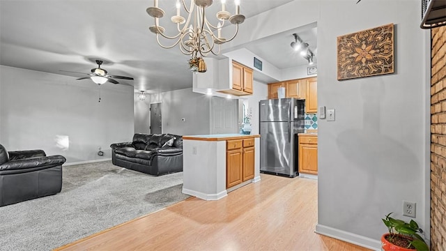6108 Sanlin Dr, Moon/Crescent Twp, PA 15108 - kitchen featuring freestanding refrigerator, open floor plan, light wood-type flooring, and a ceiling fan