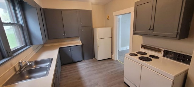 304 Elm Ave, Sharon, PA 16146 - kitchen featuring white appliances, light wood-type flooring, light countertops, and gray cabinets