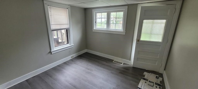 304 Elm Ave, Sharon, PA 16146 - doorway to outside featuring a drop ceiling and dark wood-style flooring