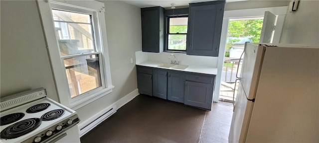 304 Elm Ave, Sharon, PA 16146 - kitchen featuring white appliances, a baseboard heating unit, light countertops, and gray cabinetry