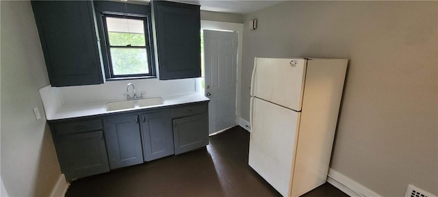 304 Elm Ave, Sharon, PA 16146 - kitchen featuring freestanding refrigerator and light countertops
