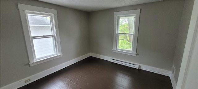 304 Elm Ave, Sharon, PA 16146 - spare room with a baseboard radiator and dark wood-style flooring