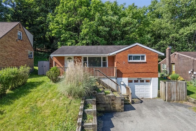 11256 Azalea Dr, Penn Hills, PA 15235 - view of front of property featuring driveway, brick siding, an attached garage, stairs, and a porch