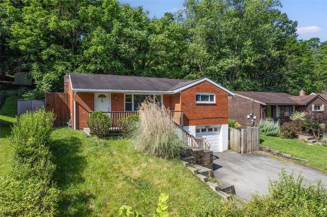 11256 Azalea Dr, Penn Hills, PA 15235 - ranch-style home featuring asphalt driveway, a garage, brick siding, a porch, and stairway