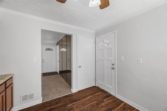 11256 Azalea Dr, Penn Hills, PA 15235 - spare room featuring ceiling fan, dark wood-style flooring, a textured ceiling, and crown molding