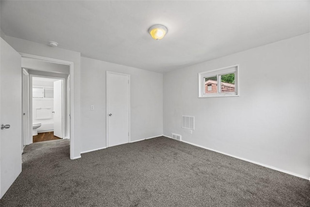 11256 Azalea Dr, Penn Hills, PA 15235 - unfurnished bedroom with dark colored carpet and baseboards