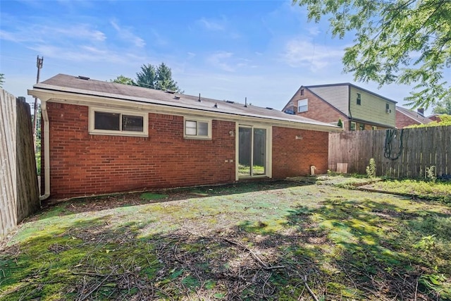 11256 Azalea Dr, Penn Hills, PA 15235 - rear view of property with a fenced backyard and brick siding