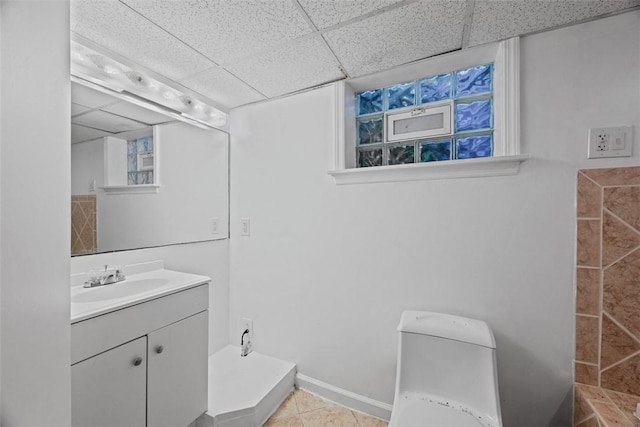 11256 Azalea Dr, Penn Hills, PA 15235 - bathroom with vanity, a drop ceiling, and tile patterned floors