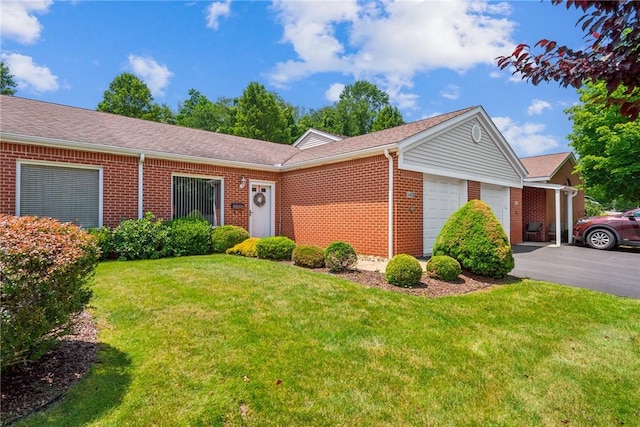 1480 Spring Crest Cir, Derry Twp, PA 15650 - ranch-style house with brick siding, an attached garage, a front yard, driveway, and a shingled roof
