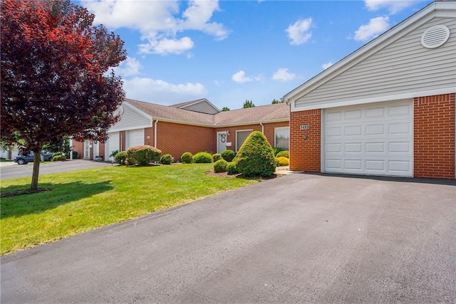 1480 Spring Crest Cir, Derry Twp, PA 15650 - ranch-style house with brick siding, a front lawn, a garage, and driveway