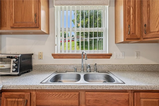 1480 Spring Crest Cir, Derry Twp, PA 15650 - kitchen with plenty of natural light, light countertops, and brown cabinets