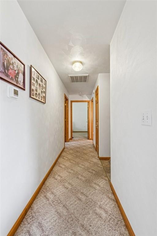 1480 Spring Crest Cir, Derry Twp, PA 15650 - hallway featuring light colored carpet and baseboards
