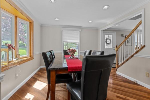 859 Boulder Dr, Bethel Park, PA 15102 - dining area featuring crown molding, wood finished floors, stairway, and recessed lighting