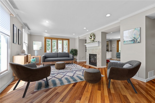 859 Boulder Dr, Bethel Park, PA 15102 - living area with wood finished floors, recessed lighting, a fireplace, and ornamental molding