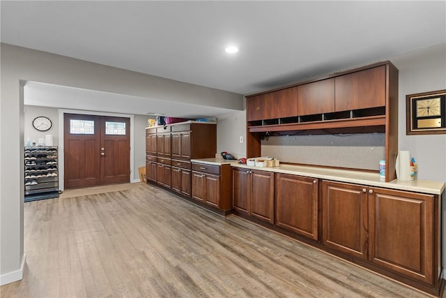 859 Boulder Dr, Bethel Park, PA 15102 - kitchen featuring light wood finished floors, light countertops, and brown cabinets