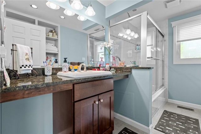859 Boulder Dr, Bethel Park, PA 15102 - bathroom with vanity, combined bath / shower with glass door, and recessed lighting