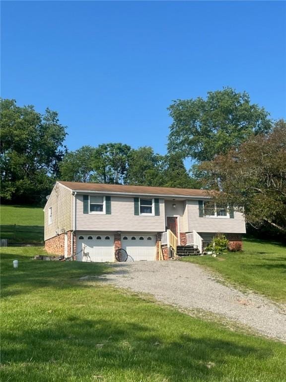 1957 Craft Creek Rd, Claysville, PA 15323 - split foyer home featuring a garage, driveway, and a front yard