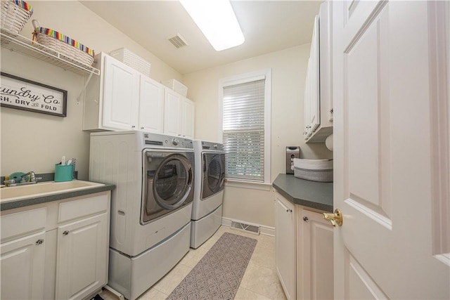 503 Sharon Rd, Moon/Crescent Twp, PA 15108 - washroom featuring cabinet space, washer and clothes dryer, and light tile patterned flooring