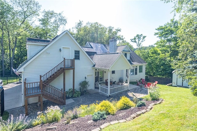 503 Sharon Rd, Moon/Crescent Twp, PA 15108 - back of house featuring a shed, a chimney, a patio, stairs, and a shingled roof