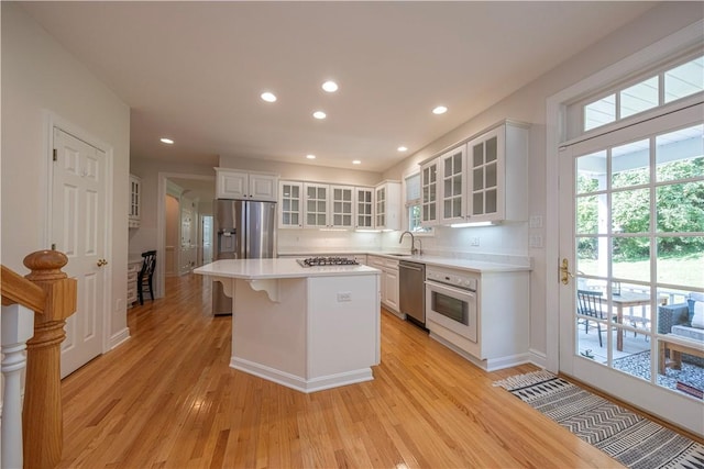 503 Sharon Rd, Moon/Crescent Twp, PA 15108 - kitchen featuring stainless steel appliances, healthy amount of natural light, light wood finished floors, a center island, and recessed lighting