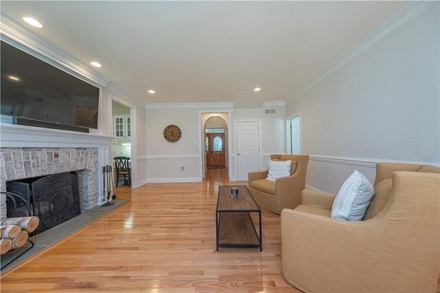 503 Sharon Rd, Moon/Crescent Twp, PA 15108 - living room with crown molding, light wood-style floors, a fireplace, and recessed lighting