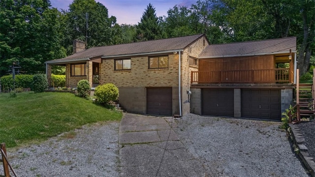 541 Duff Rd, Ohio Twp, PA 15143 - view of front of home featuring driveway, an attached garage, a yard, and brick siding