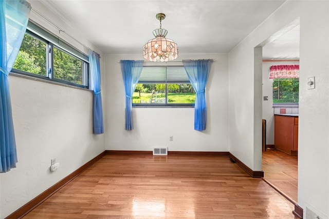 541 Duff Rd, Ohio Twp, PA 15143 - spare room featuring plenty of natural light, light wood-style floors, and a chandelier