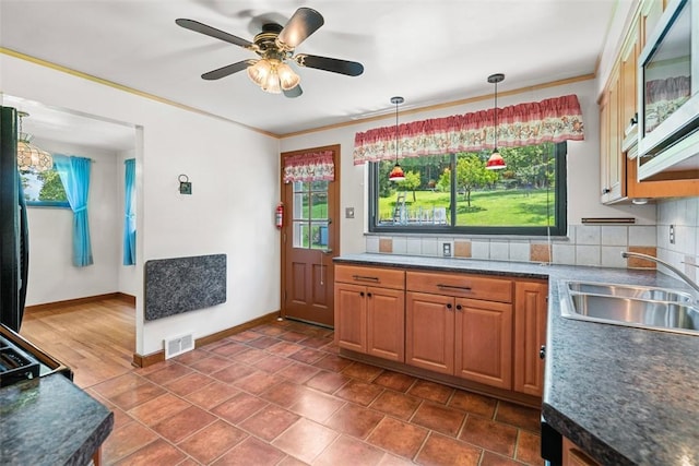 541 Duff Rd, Ohio Twp, PA 15143 - kitchen featuring plenty of natural light, a ceiling fan, backsplash, and ornamental molding