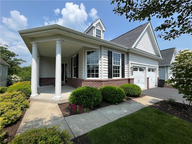 261 Patriot Ln, Economy, PA 15042 - view of front of property with a porch, brick siding, driveway, and an attached garage
