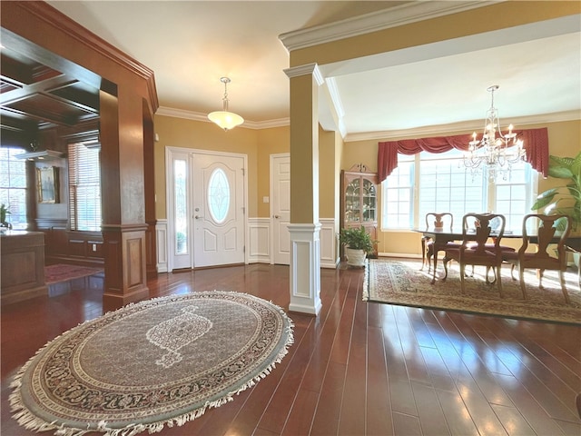 261 Patriot Ln, Economy, PA 15042 - entrance foyer with ornate columns, plenty of natural light, dark wood-type flooring, a chandelier, and a decorative wall