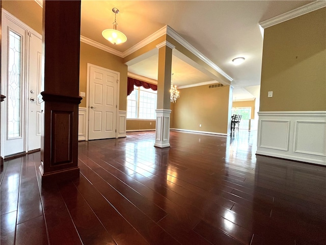 261 Patriot Ln, Economy, PA 15042 - foyer with ornate columns, crown molding, wainscoting, dark wood-style floors, and a decorative wall