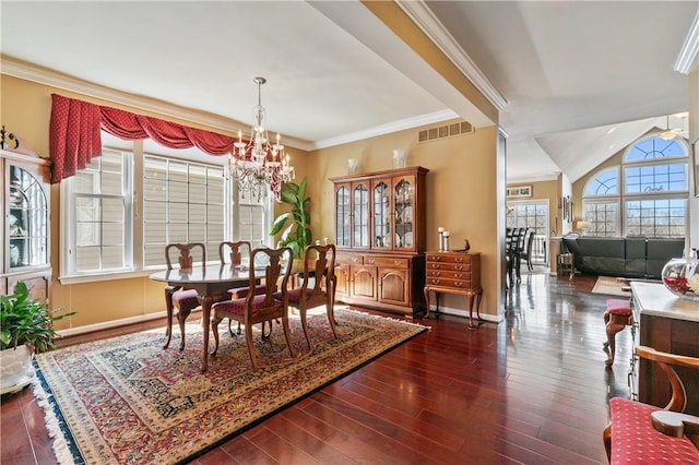 261 Patriot Ln, Economy, PA 15042 - dining room featuring a chandelier, wood finished floors, and ornamental molding