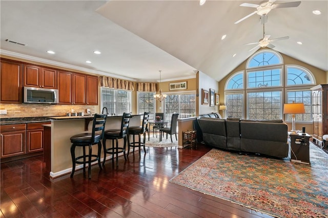 261 Patriot Ln, Economy, PA 15042 - living area featuring dark wood-style flooring, ceiling fan, recessed lighting, vaulted ceiling, and a chandelier