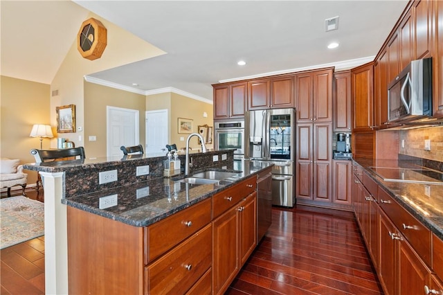 261 Patriot Ln, Economy, PA 15042 - kitchen featuring stainless steel appliances, dark wood-style flooring, crown molding, dark stone counters, and an island with sink