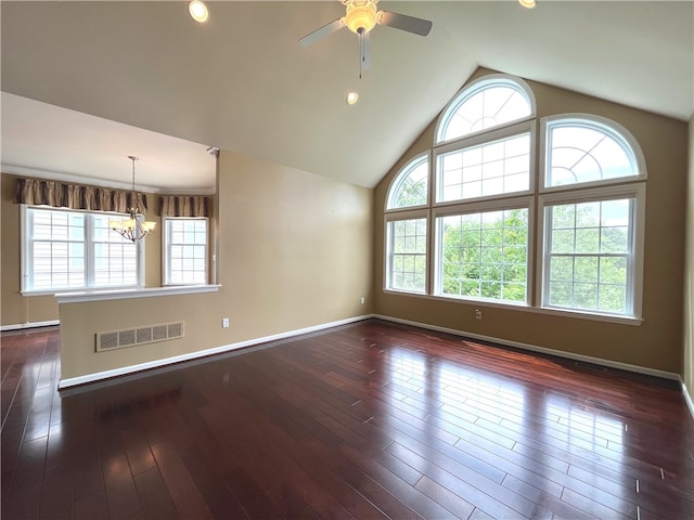 261 Patriot Ln, Economy, PA 15042 - spare room featuring a chandelier, a ceiling fan, vaulted ceiling, dark wood-style flooring, and recessed lighting