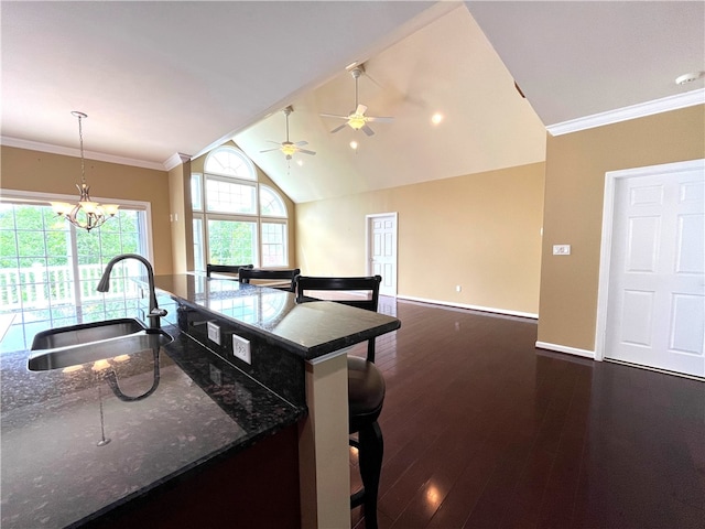 261 Patriot Ln, Economy, PA 15042 - kitchen featuring dark wood-style flooring, lofted ceiling, a chandelier, crown molding, and pendant lighting