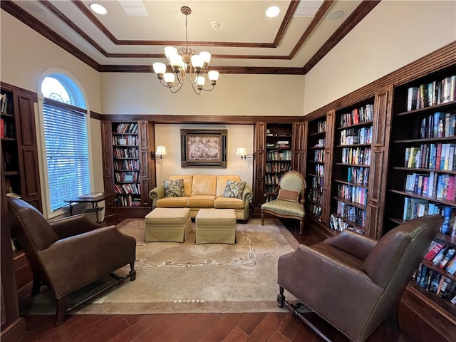 261 Patriot Ln, Economy, PA 15042 - sitting room with bookshelves, dark wood-type flooring, a chandelier, and ornamental molding