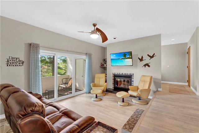 1410 Kenzie Dr, Robinson Twp, PA 15205 - living area featuring a glass covered fireplace, light wood-type flooring, ceiling fan, and recessed lighting