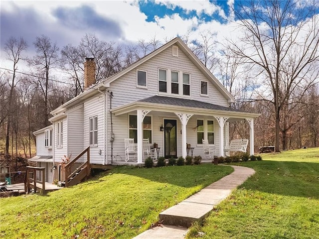 670 Sugar Camp Rd, Finleyville, PA 15332 - view of front of property featuring a chimney, covered porch, and a front yard