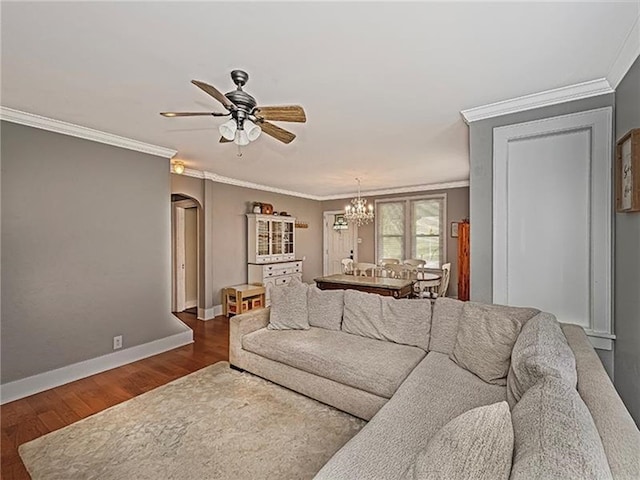 670 Sugar Camp Rd, Finleyville, PA 15332 - living area with arched walkways, wood finished floors, ornamental molding, ceiling fan, and a chandelier