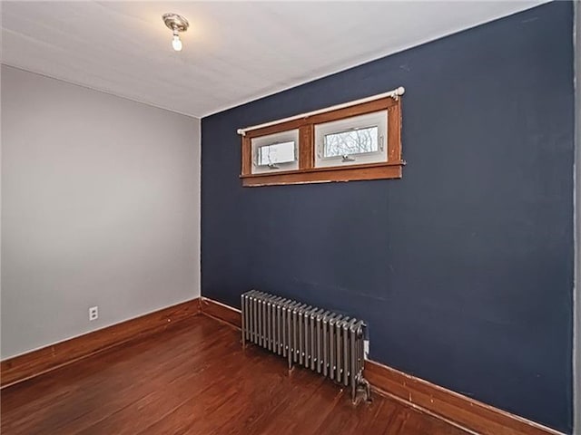 670 Sugar Camp Rd, Finleyville, PA 15332 - spare room featuring radiator and wood finished floors