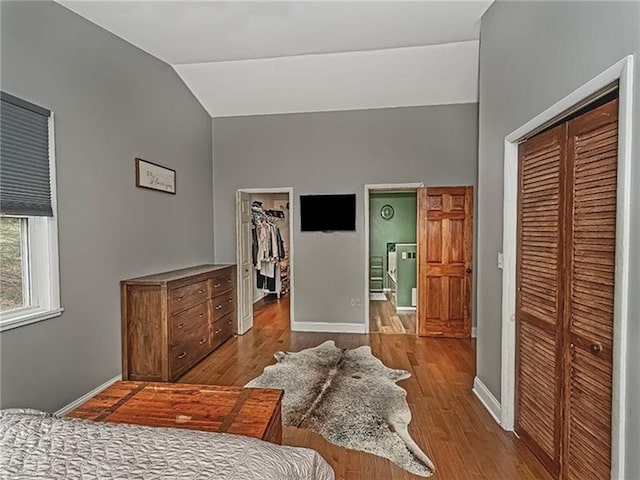 670 Sugar Camp Rd, Finleyville, PA 15332 - bedroom featuring a closet, lofted ceiling, wood finished floors, and a spacious closet