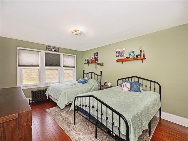670 Sugar Camp Rd, Finleyville, PA 15332 - bedroom featuring radiator heating unit and hardwood / wood-style flooring
