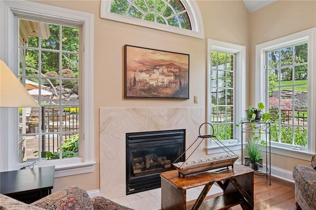 532 Salem Heights Dr, Pine Twp Nal, PA 15044 - living room featuring plenty of natural light, a tiled fireplace, and wood finished floors