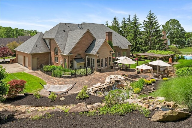 532 Salem Heights Dr, Pine Twp Nal, PA 15044 - back of property featuring a garage, concrete driveway, and a patio