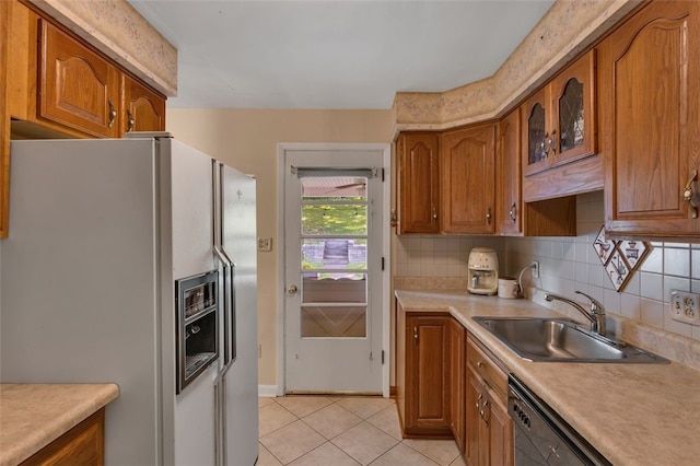 2860 Beaver Rd, Pa, PA 15003 - kitchen with white refrigerator with ice dispenser, brown cabinets, light countertops, and light tile patterned flooring
