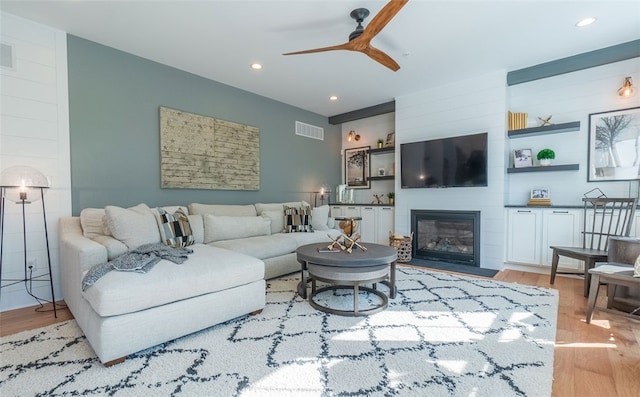 421 Johnston Rd, Saint Clair, PA 15241 - living room featuring wood finished floors, ceiling fan, a fireplace, and recessed lighting
