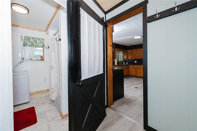 68 Riverside Ave, Center Twp/Homer Cty, PA 15748 - corridor featuring washing machine and dryer and baseboards