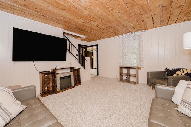 68 Riverside Ave, Center Twp/Homer Cty, PA 15748 - carpeted living area featuring wooden ceiling, stairway, and a stone fireplace